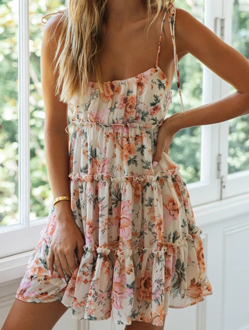 FJØRNA resort style white high-end short dress with sexy print, perfect for summer or beachwear, shown from the front.