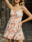 Orange floral print short sleeve dress by FJØRNA, casual wedding dress with a relaxed fit and vibrant floral pattern.