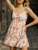Orange floral print short sleeve dress by FJØRNA, casual wedding dress with a relaxed fit and vibrant floral pattern.