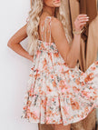 Orange floral print short sleeve dress by FJØRNA, casual wedding dress style, with a lightweight, flowy fabric and feminine design.