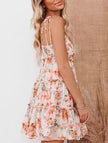 FJØRNA casual floral print short sleeve dress for women, perfect for casual weddings, in vibrant orange with a flowy design.