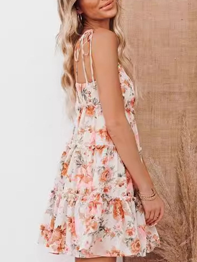 FJØRNA casual floral print short sleeve dress for women, perfect for casual weddings, in vibrant orange with a flowy design.