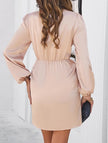 FJØRNA elegant solid white V-neck dress displayed on a hanger, showcasing its simple, stylish design and smooth fabric.