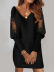 Black V-neck lace patchwork printed dress by FJØRNA, featuring intricate lace details and a stylish cut on a model.