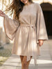 White FJØRNA round neck flare sleeve belted dress with a fitted waist and elegant design, perfect for casual or dressy occasions.