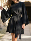 Black round neck flare sleeve belted dress by FJØRNA, showcasing a stylish design with a fitted waist and elegant flare sleeves.