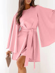 White round neck flare sleeve belted dress by FJØRNA, featuring a stylish fit and elegant design, shown on a model.
