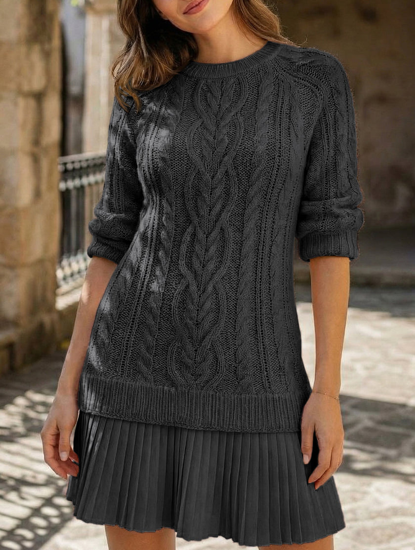 Black cable knit chiffon patchwork mini dress by FJØRNA, featuring a cozy cable knit design and lightweight chiffon fabric.