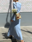 Blue FJØRNA V-neck cardigan maxi dress, slim fit, elegant design, flowing fabric, perfect for versatile stylish occasions.