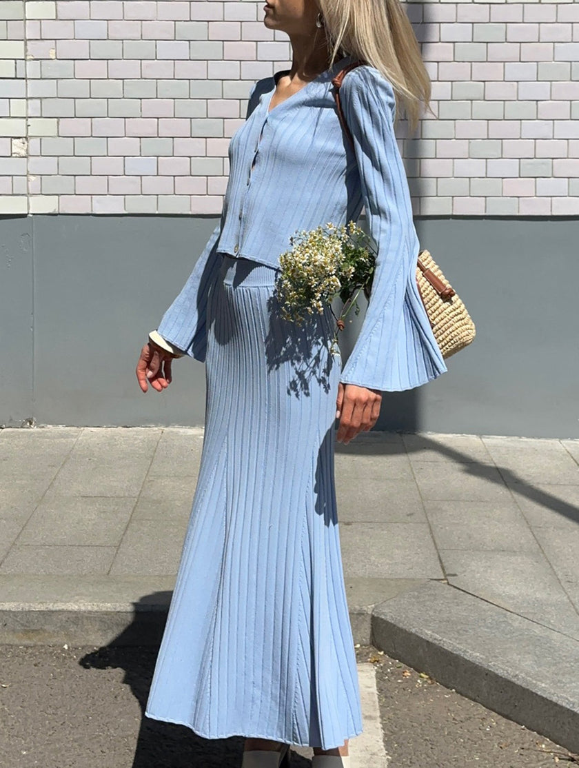 Blue FJØRNA V-neck cardigan maxi dress, slim fit, elegant design, made for versatile wear, shown on a model against a plain background.