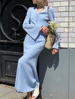 FJØRNA white V-neck maxi dress featuring a slim fit and versatile design, ideal for casual or formal occasions.