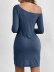 Blue FJØRNA loose solid long sleeve T-shirt dress displayed hanging on a minimal white background.