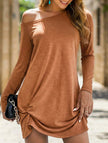 FJØRNA loose solid white long sleeve T-shirt dress hanging on a rack, casual and comfortable style for everyday wear.