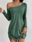 White FJØRNA loose solid long sleeve T-shirt dress hanging on a clothing rack.