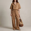 FJØRNA caramel zip-neck top and wide-leg trouser set, stylish 2-piece outfit, featuring a zip-up top and flowing trousers.