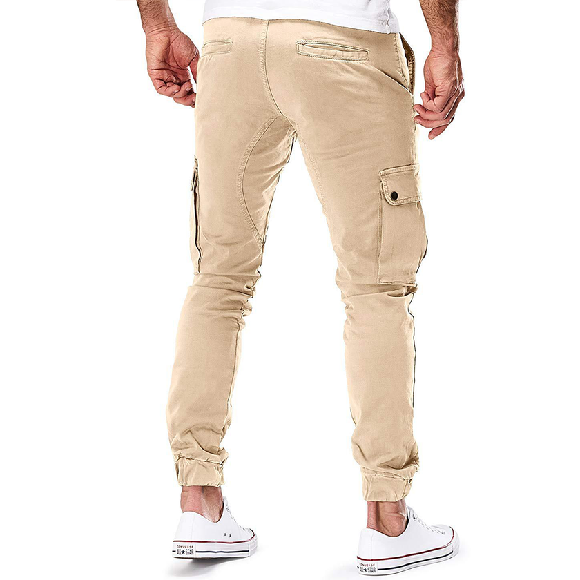 Men's FJØRNA cargo jogging pants with slim fit design, featuring multiple pockets and a fur-lined interior for outdoor wear.