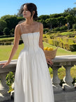FJØRNA women's strapless satin corset midi dress with full skirt, sleeveless and fitted, ideal for wedding guest attire.