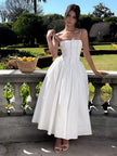 FJØRNA strapless satin corset midi dress for women, sleeveless with a fitted, structured bodice and full skirt, perfect for weddings.