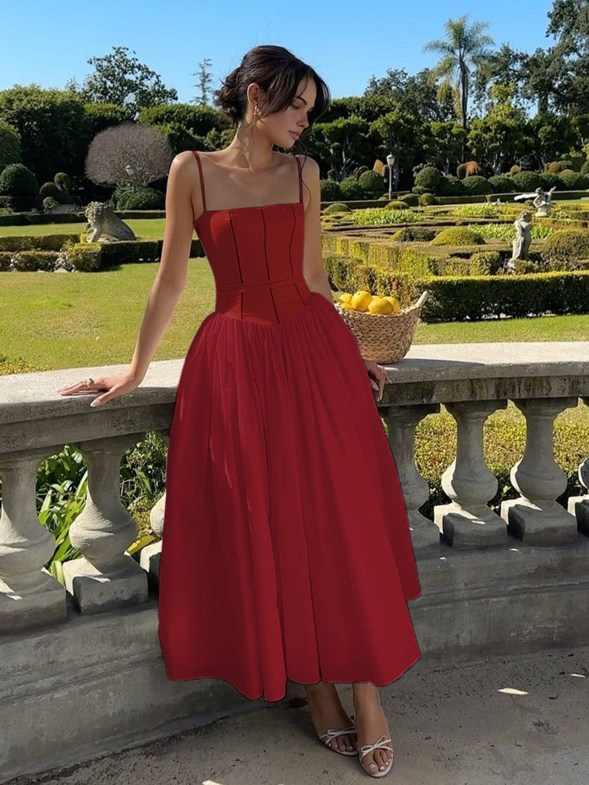 FJØRNA strapless satin corset midi dress with full skirt, fitted and sleeveless, perfect for wedding guests or formal occasions.