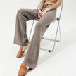 FJØRNA merino wool wide-leg high-waist trousers for women, thick knitted pants with vertical ribbing, suitable for casual or professional wear.