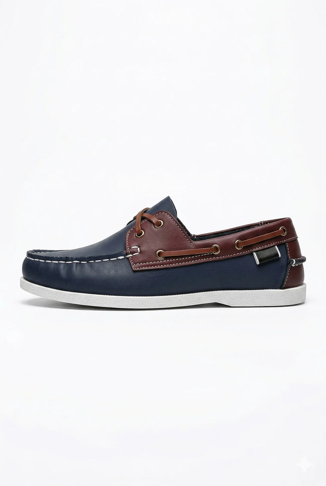 FJØRNA men's boat shoes with navy PU upper, nautical style, smart casual design, featuring white laces and rubber sole.