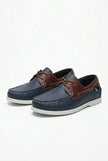 Men's boat shoes by FJØRNA with PU upper, nautical styling, and casual design, shown in a refined spring-ready look.