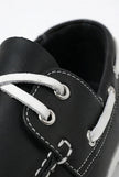 FJØRNA men's boat shoes with navy PU upper, nautical style, casual design, featuring white laces and slip-on slip-resistant soles.