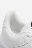 White men's walking shoes by FJØRNA featuring breathable material, cushioned support, and lightweight casual design.
