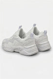 White mesh trainers for women by FJØRNA, lightweight and breathable casual shoes with a comfortable fit.