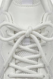 White mesh trainers for women by FJØRNA, breathable lightweight casual shoes with cushioned soles and sporty design.