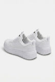 Men's minimalist white trainers by FJØRNA, showcasing clean, sleek design and classic sneaker style for everyday wear.