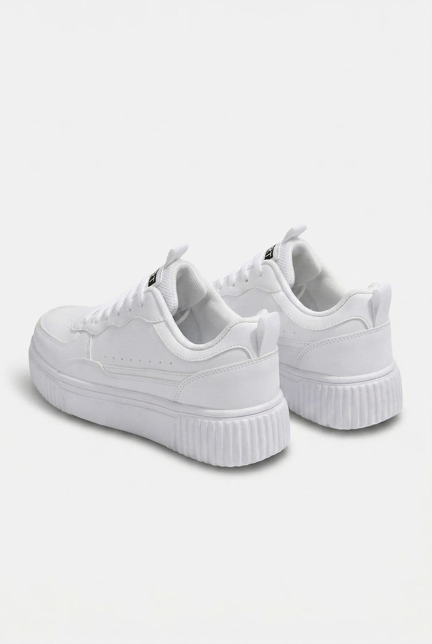 Men's minimalist white trainers by FJØRNA, showcasing clean, sleek design and classic sneaker style for everyday wear.