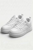White minimalist women's trainers by FJØRNA, casual and timeless shoes with clean design and comfortable fit.