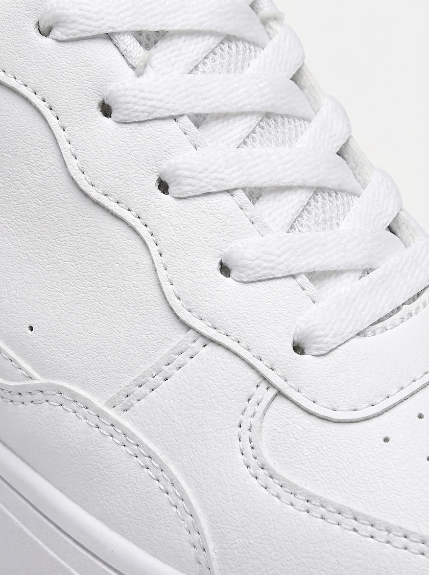 FJØRNA white minimalist men's trainers, clean everyday shoes with a sleek design and comfortable fit, shown from the side.