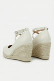 FJØRNA women's ankle-strap wedge sandals with espadrille platform and elegant design, shown in a side view.