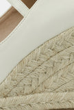 FJØRNA women's ankle-strap wedge sandals with espadrille platform and elegant design, shown from a front angle.