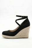 FJØRNA women's ankle-strap wedge sandals with espadrille platform and elegant design, shown from the side on a white background.