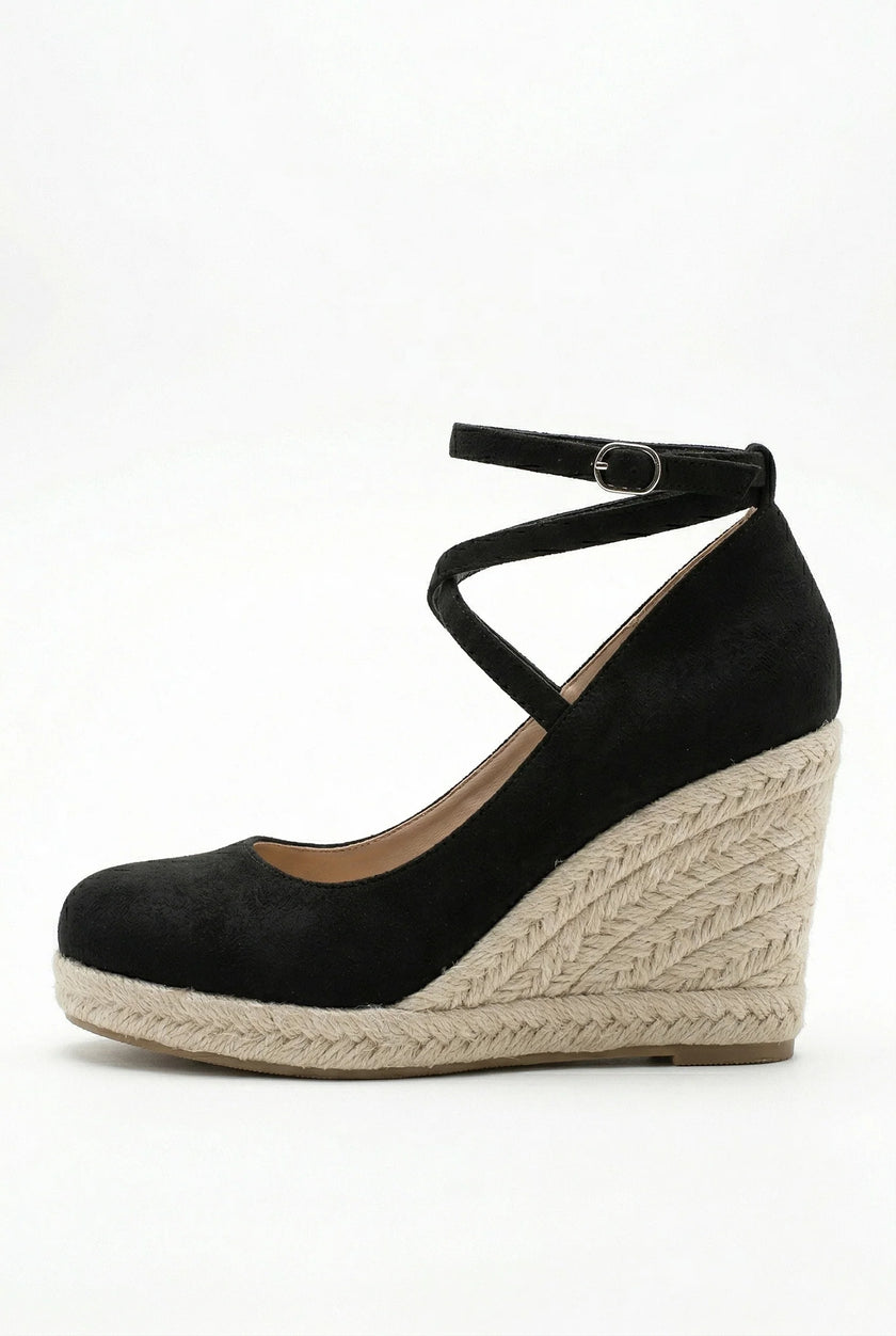 FJØRNA women's ankle-strap wedge sandals with espadrille platform and elegant design, shown from the side on a white background.