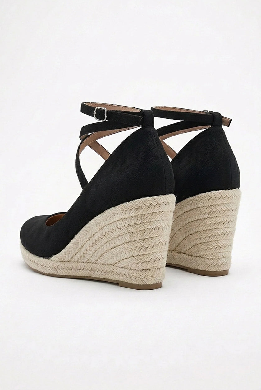 FJØRNA women's ankle-strap wedge sandals with espadrille platform and elegant design, shown from a side angle.