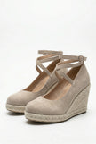 Elegant women's ankle-strap wedge sandals by FJØRNA with espadrille platform and stylish design, shown from the side.