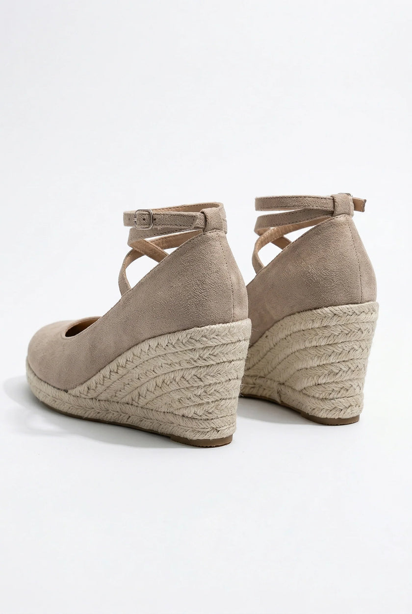 Elegant FJØRNA women’s ankle-strap wedge sandals with espadrille platform and stylish design, shown from a side angle.