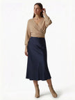Elegant FJØRNA high-waist satin midi skirt for women, flowing and stylish with a sophisticated silhouette.