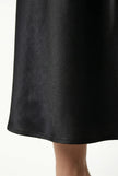 Elegant FJØRNA women's high-waist midi satin skirt with flowing design, showcasing its smooth fabric and stylish silhouette.