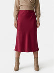 Elegant high-waist satin midi skirt for women, flowing and stylish, by FJØRNA, shown in a natural pose.