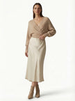 Elegant FJØRNA high-waist midi satin skirt for women, flowing design perfect for sophisticated and stylish looks.