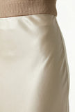 Elegant high-waist satin midi skirt for women by FJØRNA, flowing and stylish, perfect for sophisticated outfits.