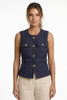 FJØRNA women's tailored sleeveless waistcoat with structured fit, layered over outfit, shown with minimalist pointed-toe heels.