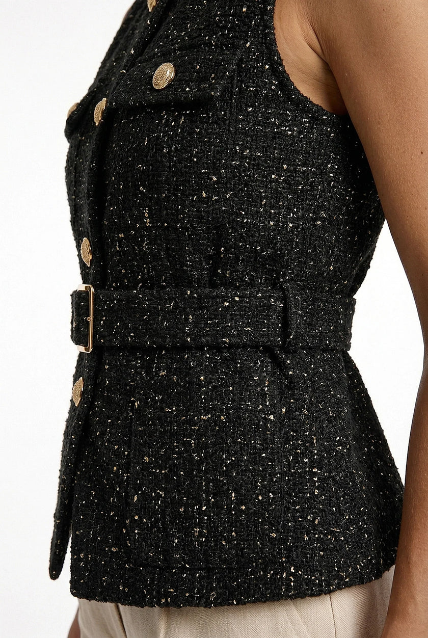 FJØRNA women’s tailored sleeveless waistcoat with structured design, layered over a stylish outfit, featuring pointed-toe heels.