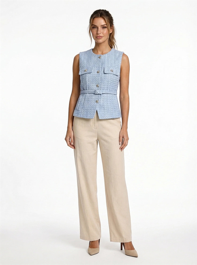 FJØRNA women's tailored sleeveless waistcoat with structured design, layered over a minimalist outfit, paired with pointed-toe heels.