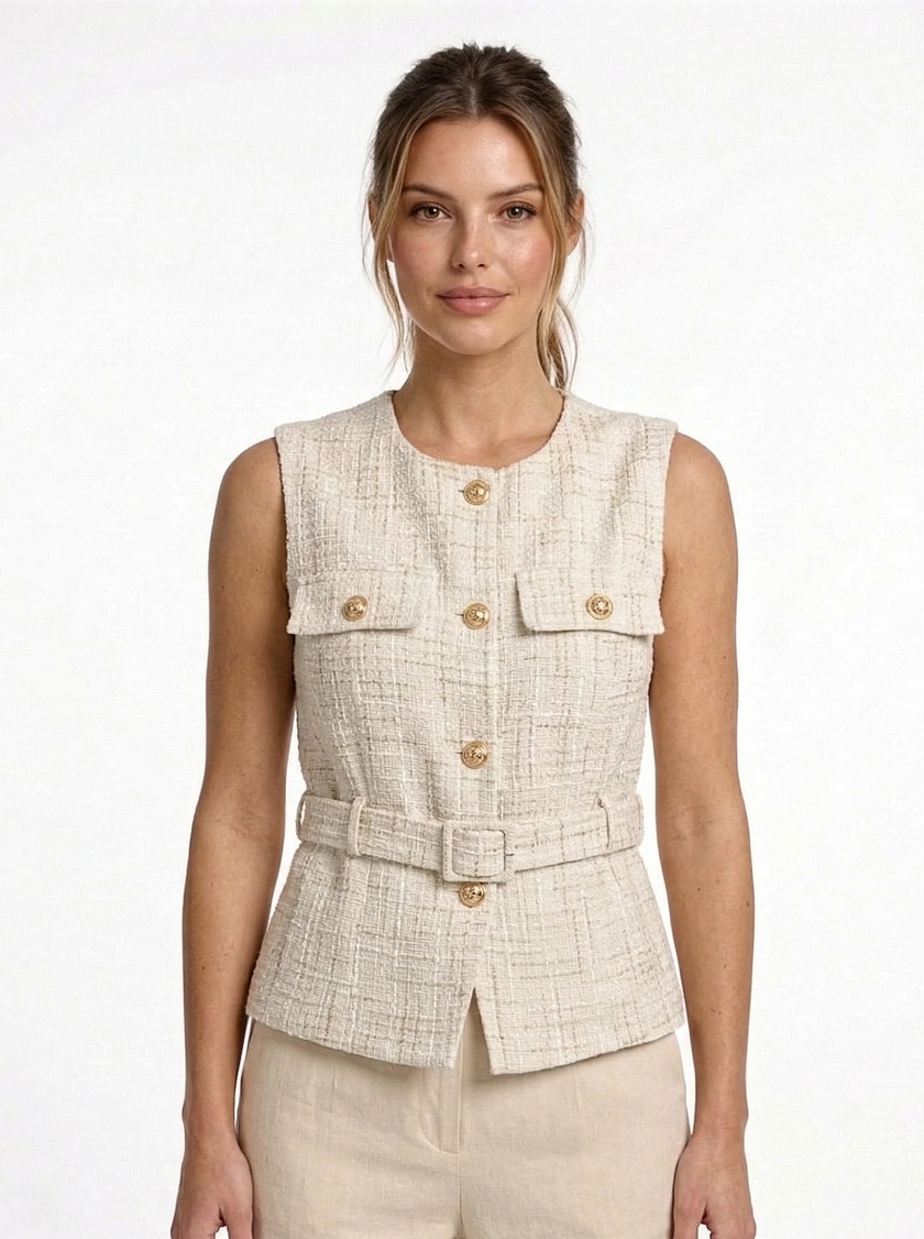 FJØRNA women's tailored sleeveless waistcoat with structured design, layered style, shown with minimalist pointed-toe heels on a woman.